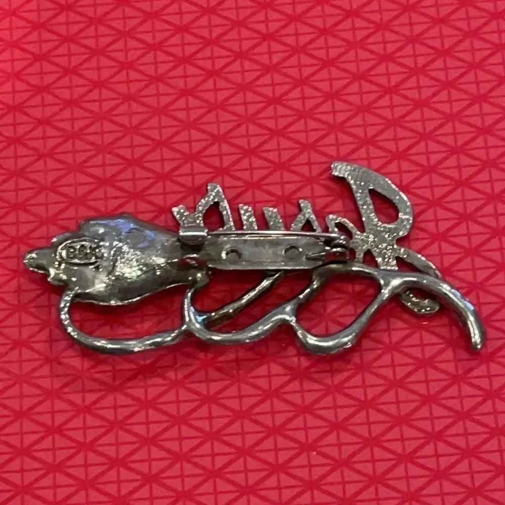 Vintage signed BSK Jesus flower silver-tone brooch